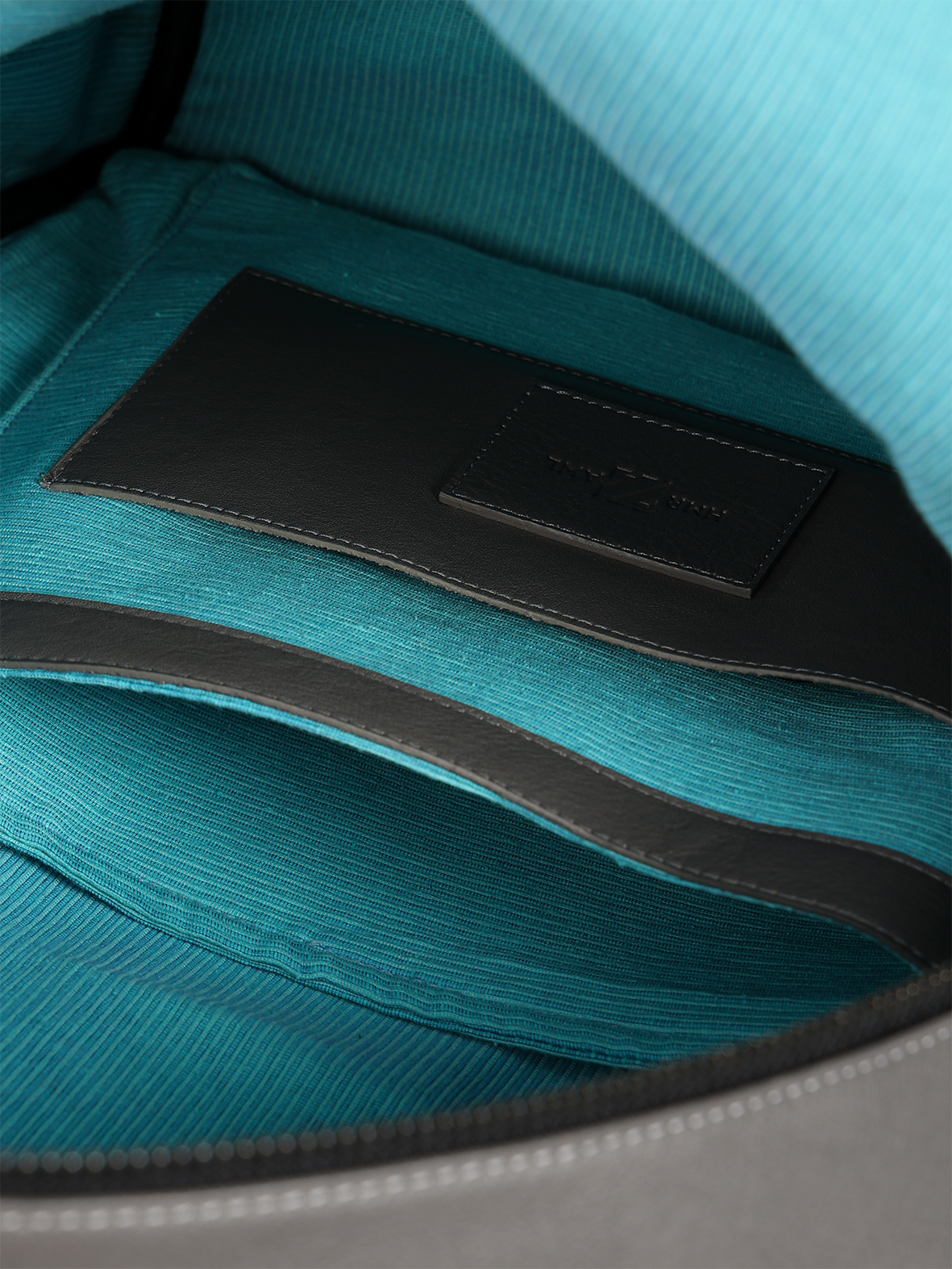 HammerAwl Black Leather Backpack Interior pockets with blue lining and leather trim