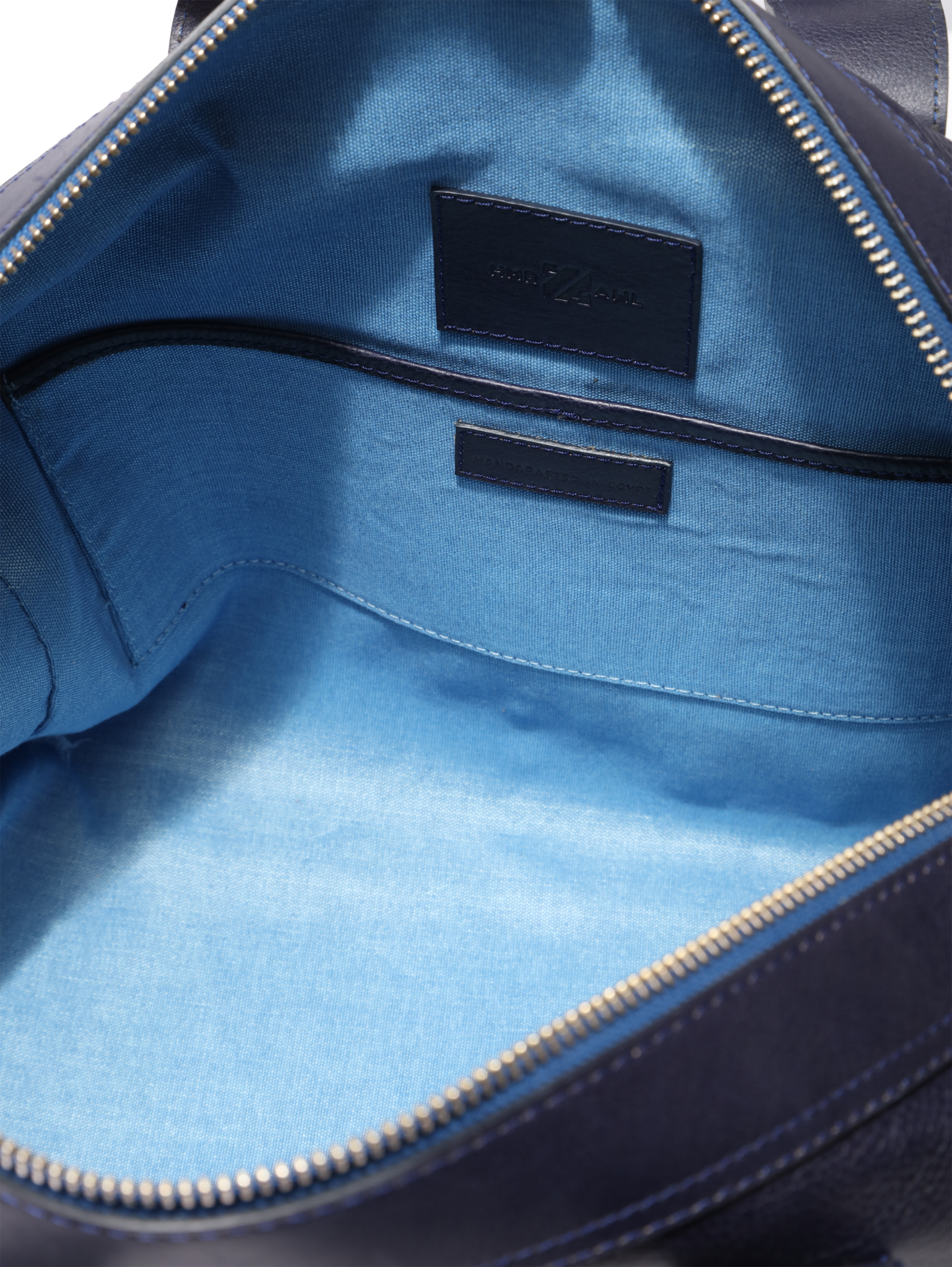 bright blue lining, leather trim pockets